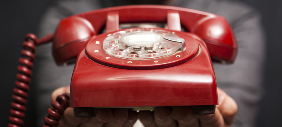 Close up photo of a red telephone